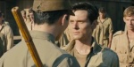 Louis Zamperini about to be whacked by sadistic guard. 